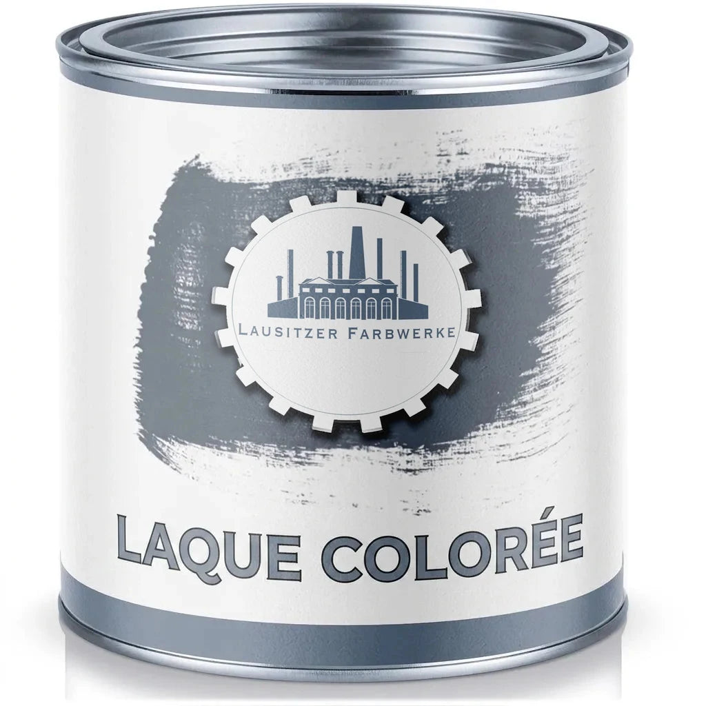 Pot de peinture argenté avec étiquette blanche, tache de peinture grise et le texte "BUNTLACK".